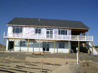Railings on the porch, except the stairs. Insulation added to the upper floor exterior. Septic field, continues to be septicy.