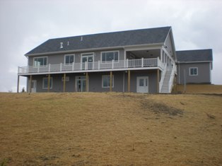 View of the yard covered with grass seed and hay