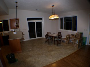 Back to interior, this time the dinning room.  Basic furniture has been put into place and moving boxes are visible against the wall.